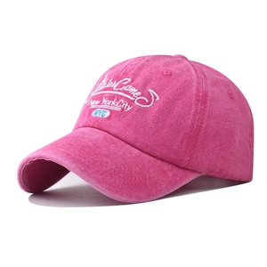 Close-up of vintage New York City embroidery on washed cotton baseball cap in rose pink