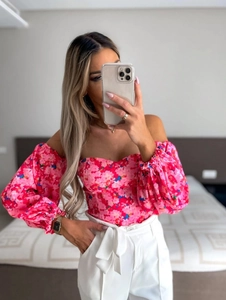 Pink floral off-shoulder blouse with long puff sleeves shown in a mirror selfie