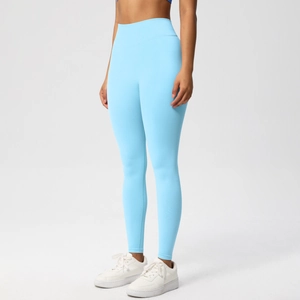 Detail view of high-waist seamless yoga leggings in light blue with peach lift effect