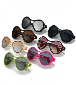 Detailed top view of trendy oversized sunglasses collection in six various vibrant colors