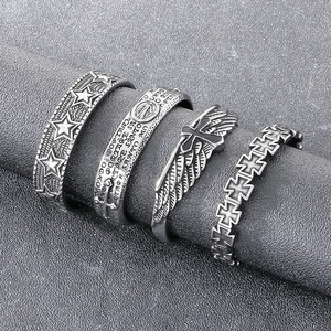 4-piece vintage silver gothic ring set featuring star, cross and wing motifs for men