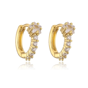Detail of gold-plated huggie earrings with star-shaped cubic zirconia on a white base