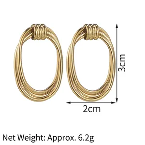 Detail view of 14K gold-plated irregular oval earrings with size markings 3cm by 2cm