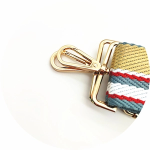 Macro shot of colorful herringbone strap with luxury gold metal swivel hook