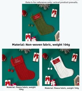 Detail of knitted Christmas stockings in green, red and white with Merry Christmas embroidery