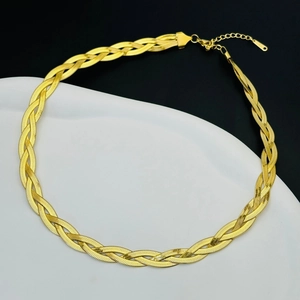 Detail of three-layer braided gold herringbone necklace with lobster clasp and chain