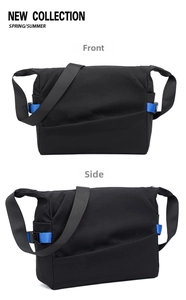 Dual views of black nylon messenger bag featuring blue ribbon accents and adjustable strap