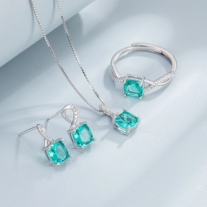 S925 sterling silver jewelry set featuring emerald green gems and diamond accents