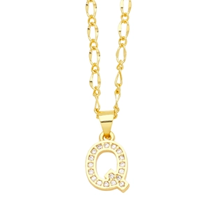 Macro shot of gold letter Q pendant featuring micro-pave white zircon inlay and delicate chain