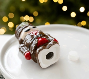 Macro view of nutcracker ceramic jar bottom with removable plug in gingerbread style