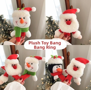 Detail of plush Christmas slap bracelets featuring Santa, snowman and penguin characters
