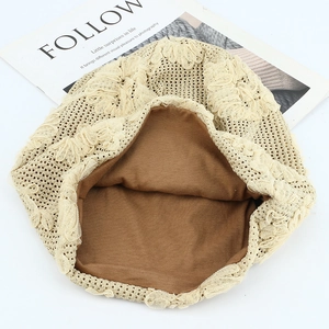 Breathable beige lace slouchy beanie with floral patterns and a dark brown inner lining