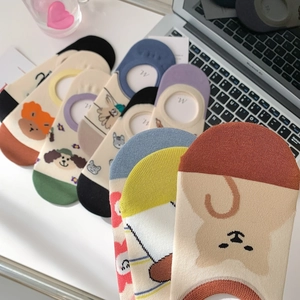 Detailed view of low cut invisible socks with cute cartoon animal patterns on cotton fabric