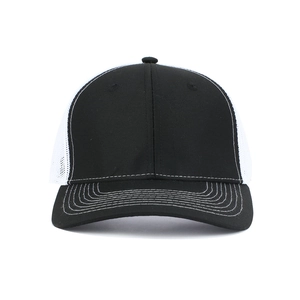 Detail of white mesh back and black curved brim on a classic two-tone trucker hat