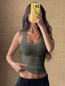 Close-up of olive green ribbed U-neck halter top showing stretch fit and fabric texture