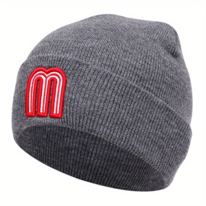 Gray knitted beanie hat with red and white embroidered M letter on white background