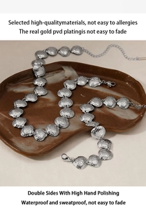 Detailed close-up of shell-shaped stainless steel necklace with waterproof PVD gold plating