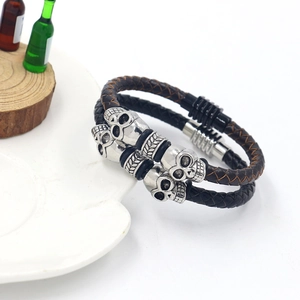 Punk woven leather skull bracelets in black and brown with secure magnetic slide clasp