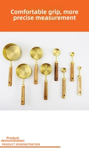 Detail showing 8-piece stainless steel measuring cups with acacia wood handles and engravings