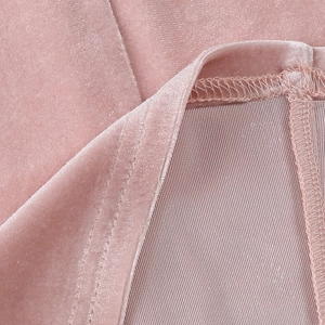 Detailed macro view of pink velvet fabric showing soft texture and premium stitching