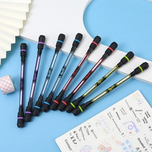 Macro shot of balanced spinning pens in seven vibrant colors on a blue creative workspace