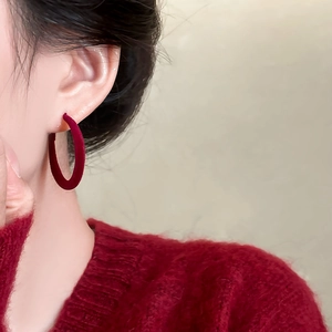 Vintage burgundy velvet hoop earring worn by model showing elegant retro design