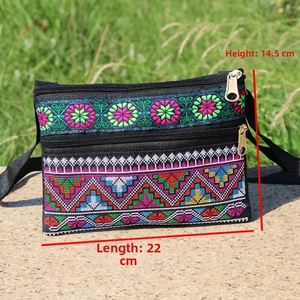 Detailed view of ethnic embroidery on canvas crossbody bag showing 22cm length and 14.5cm height