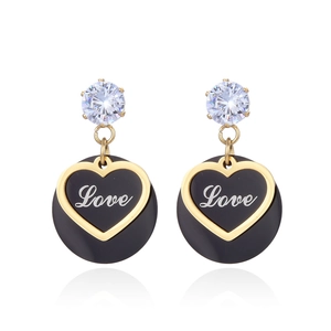 Elegant gold and black titanium steel heart earrings set with clear sparkling crystals