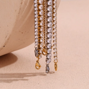 Close-up of gold and silver tennis bracelets with micro-paved cubic zirconia stones