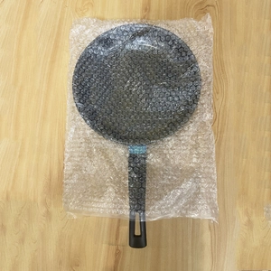 Mini non-stick induction frying pan for eggs and steaks wrapped in protective bubble wrap