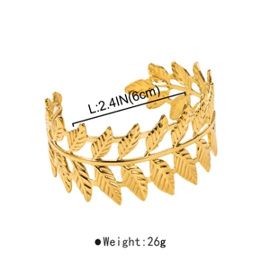 Detail view of golden laurel leaf cuff bracelet showing dimensions 6cm and 26g weight