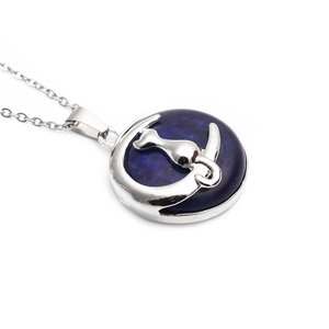 Deep blue moon and cat pendant necklace with silver chain on white background