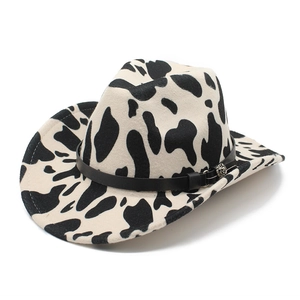 Flat brim jazz hat with black and white cow print and silver studded leather band