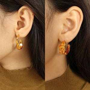 Artistic gold lava textured earrings with irregular wrinkle design for a vintage look