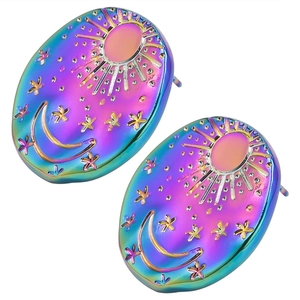 Macro shot of iridescent 304 stainless steel earrings with embossed sun, moon, and star motifs