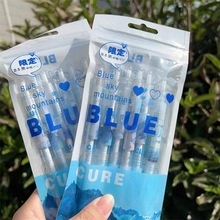 Close-up of 0.5mm blue mountain themed gel pens in plastic packaging with reflections