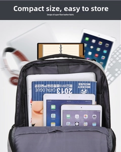 Internal multi-layer storage compartments of a grey business laptop backpack