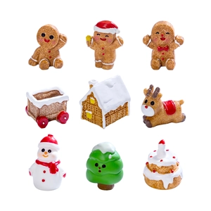 9-piece miniature Christmas resin ornament set with gingerbread man and snowy cabin