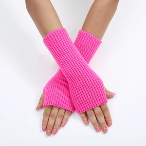 Close-up of pink knitted fingerless gloves showing striped rib texture and wrist coverage