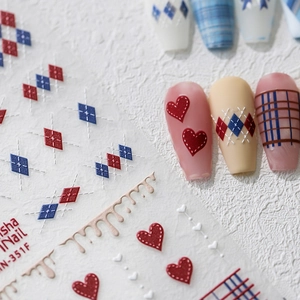 5D embossed nail stickers with red hearts and argyle patterns on white background
