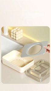 Close-up of modern soap box with double-layer drainage tray and transparent lid