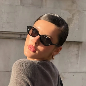 Chic black oval sunglasses for women featuring retro small frames and premium trendy style