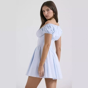 Light blue puff sleeve mini dress with corset waist and elegant off-shoulder design