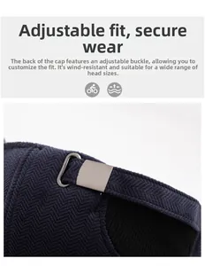 Detail of adjustable metal buckle and breathable mesh lining on navy winter cap