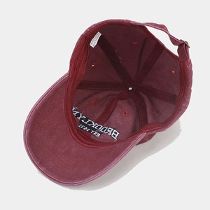 Washed cotton baseball cap in burgundy with Brooklyn embroidery and adjustable metal buckle