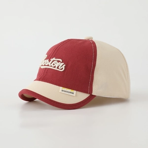 Detail of Boston embroidery and red contrast piping on kids baseball cap