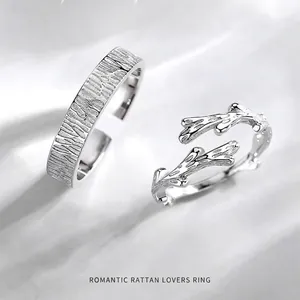Minimalist rattan lover rings in silver with bark texture and adjustable open bands