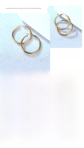 Macro comparison of small and large polished gold hollow hoop earrings set