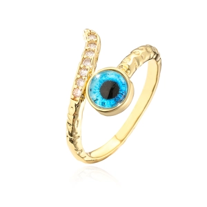 Macro detail of 18K gold plated evil eye ring with hammered texture and pave zircon