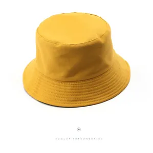 Close-up of bright yellow cotton canvas bucket hat with reinforced parallel stitching